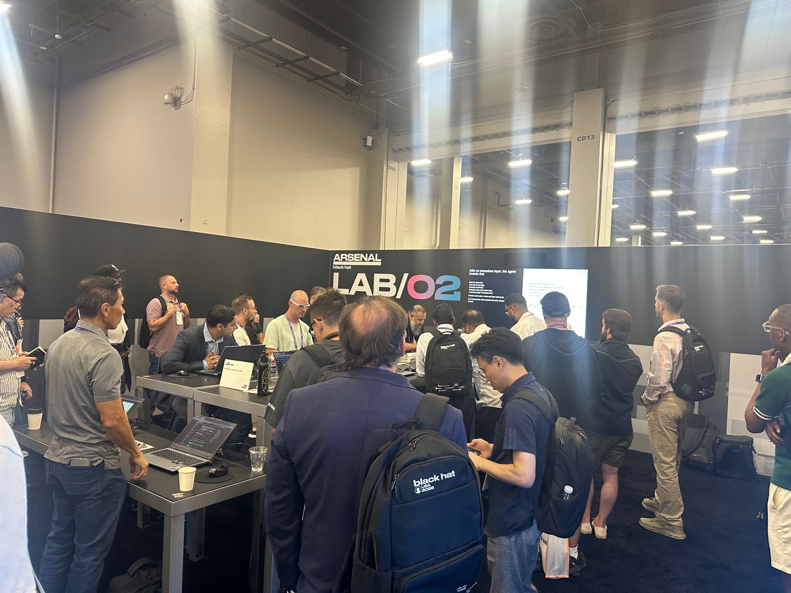 Attendees packed around the Anthropic Cybersecurity Skills demo stations