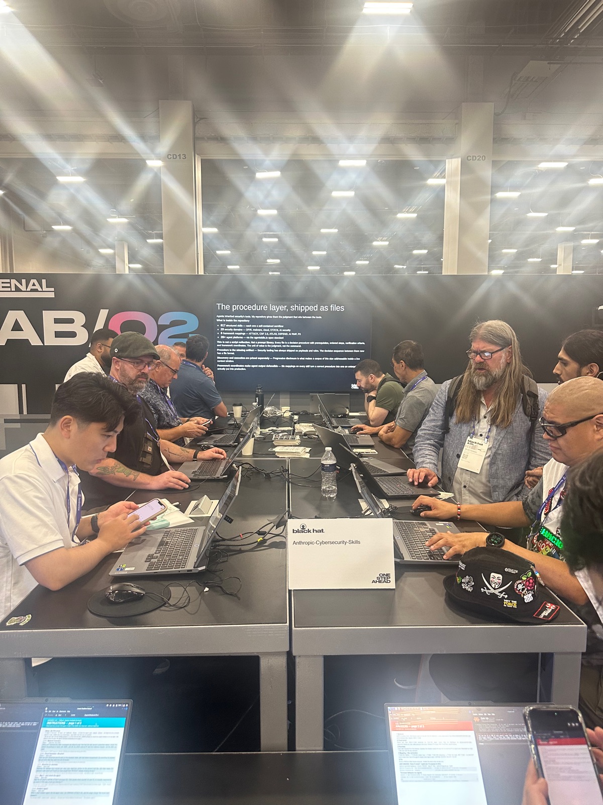 Analysts gathered around laptops running Casky at the Arsenal booth